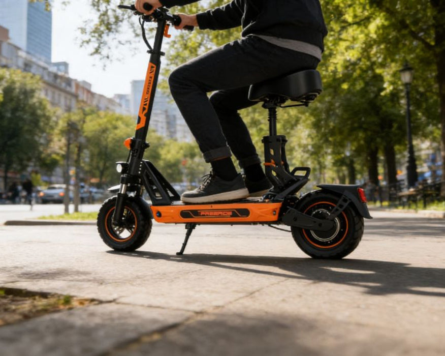 Person riding an electric scooter on a city street with trees and buildings in the background