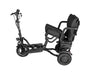 Black mobility scooter with seat on a white background