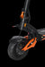 Close-up of an electric scooter with black and orange design on a transparent background
