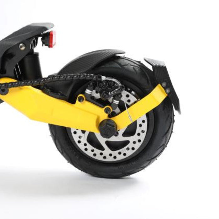 Close-up of a scooter wheel with yellow suspension fork on a white background