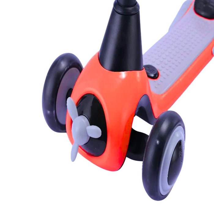 Close-up of a red scooter with black wheels on a white background