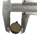 Metallic brake pad with a vernier caliper for measurement on a white background